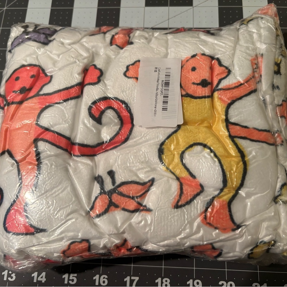 Colorful Monkey Print throw. Very cute monkeys. Like in Toy Story diff sides